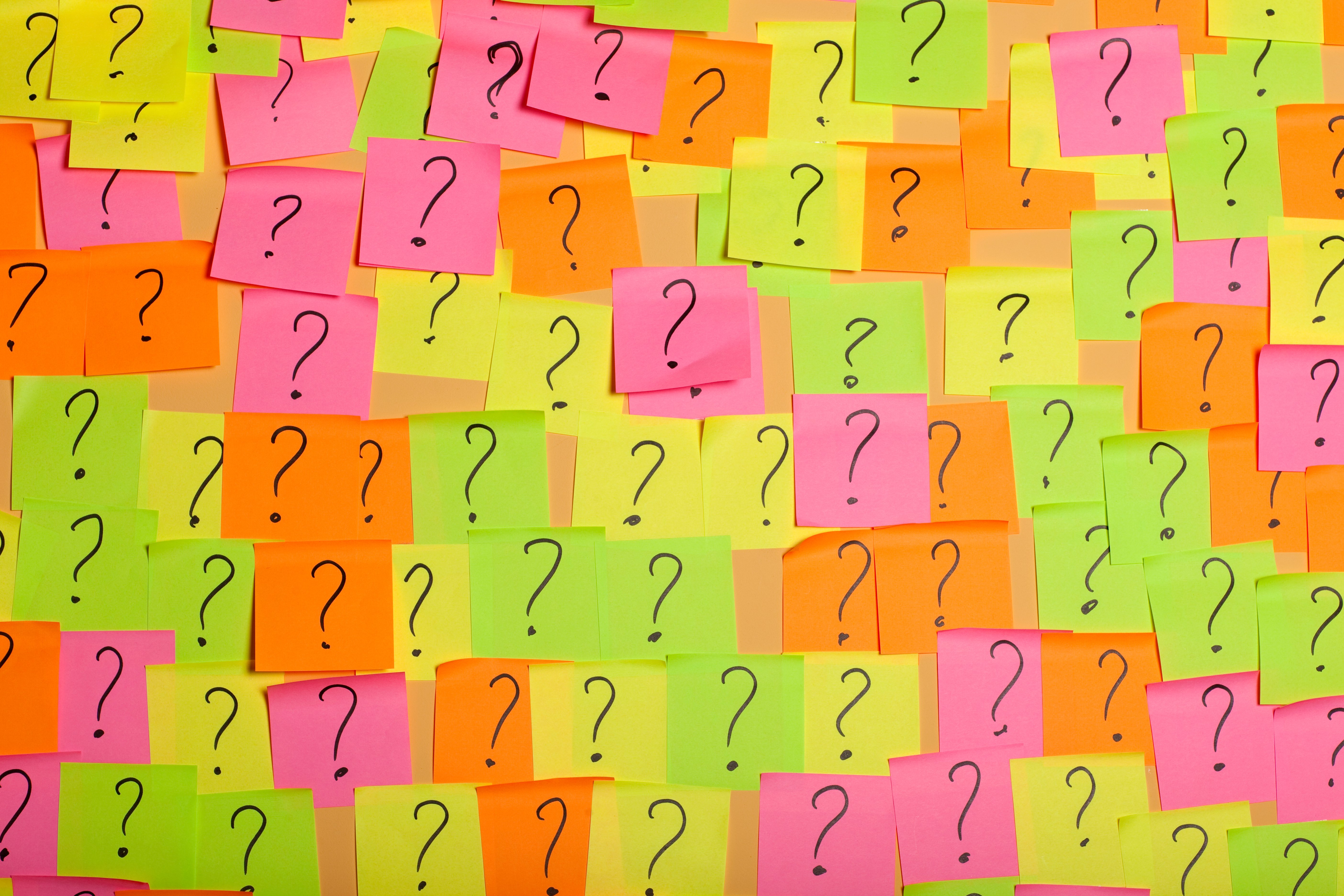 Canva - Collage of multicolor notepad squares with question marks