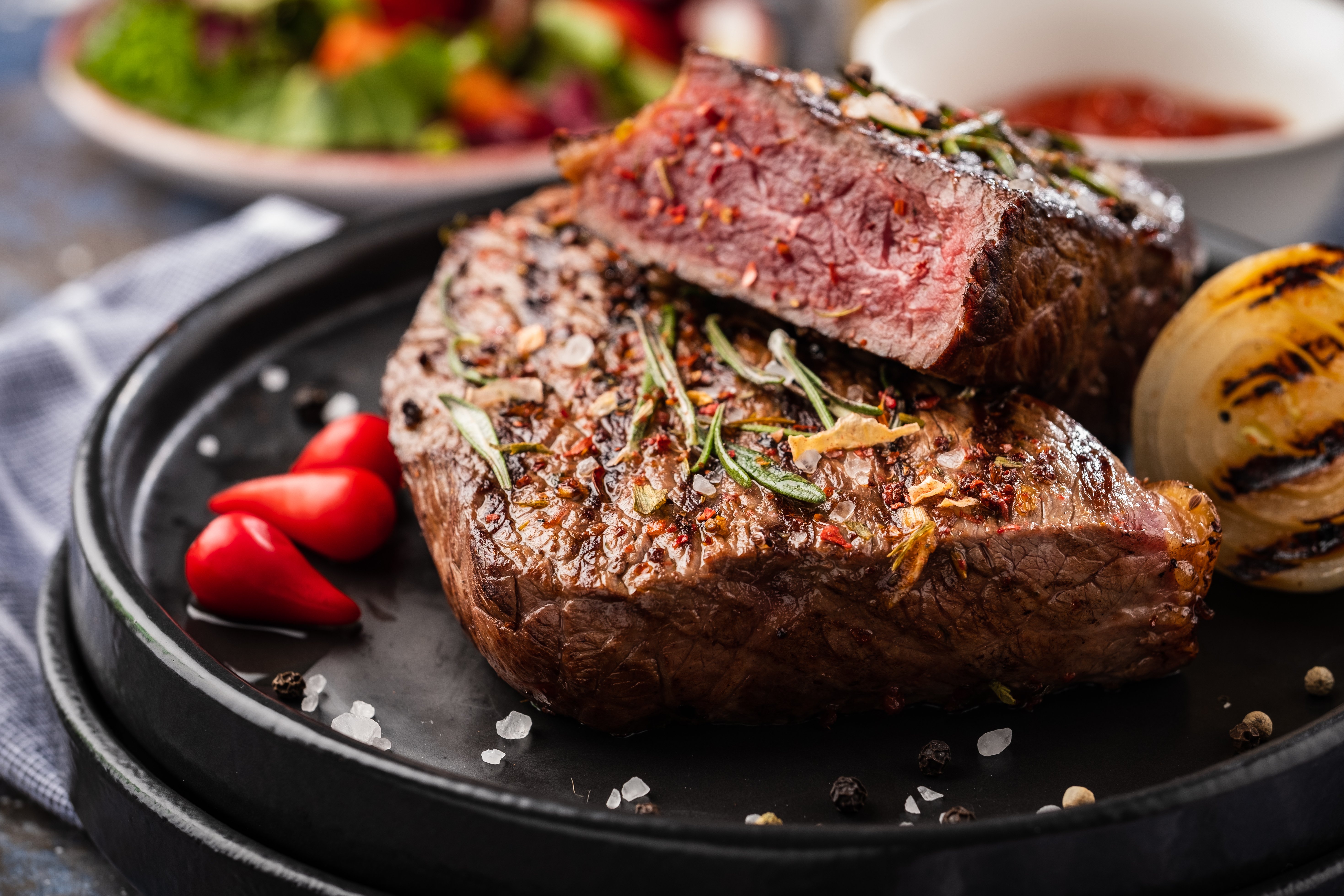 Canva - Steak Beef. Beef Steak Medium with Red Pepper, Aromatic Herbs an